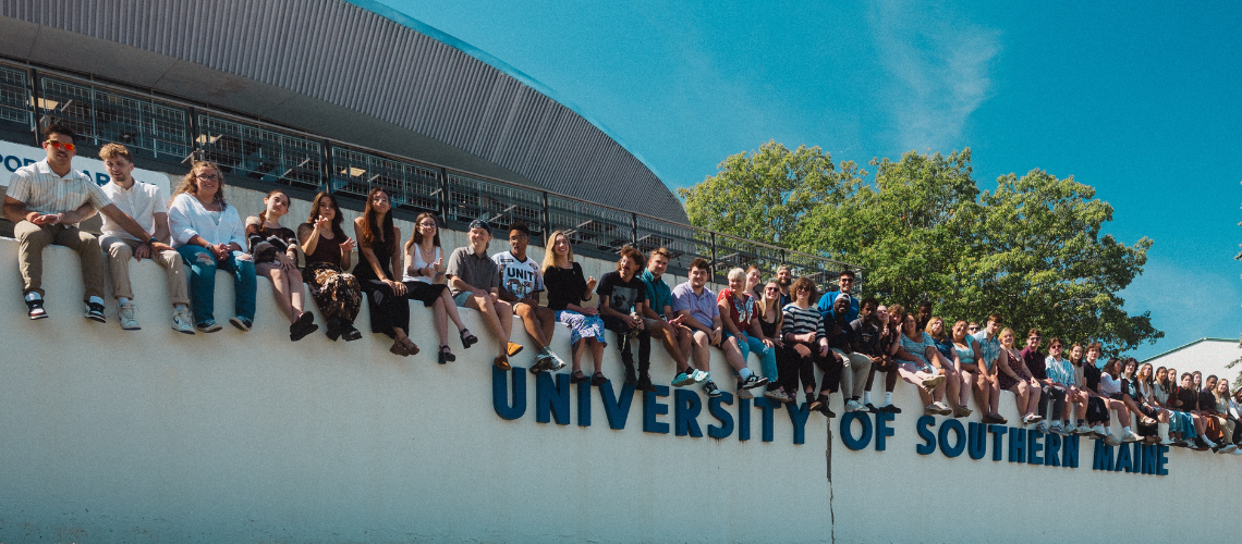 students on wall, Gorham campus