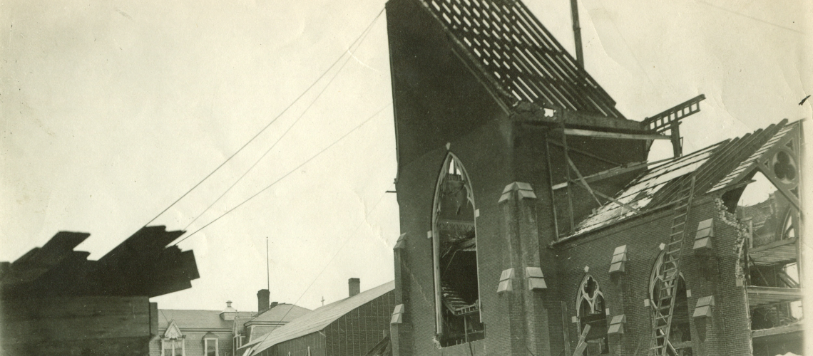 Black and white image of demolition of St. Peter's church to make way for a larger church.