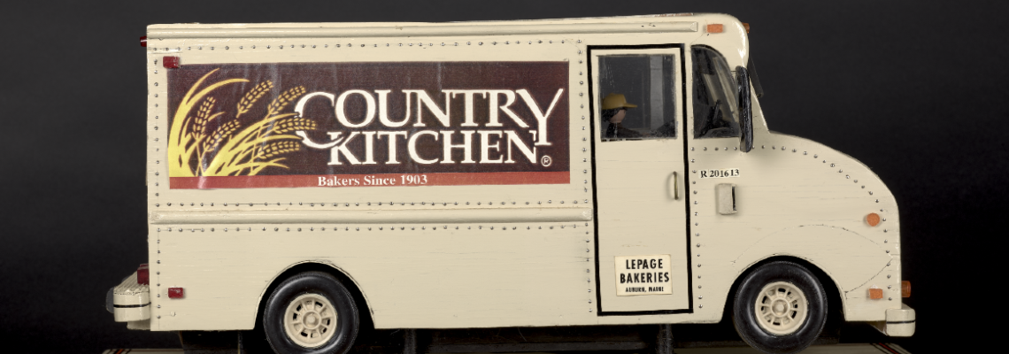 Toy truck with Country Kitchen bakery logo.