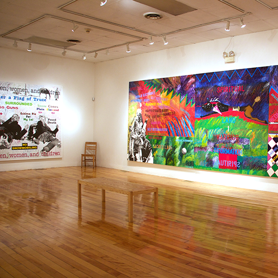 An image of a gallery with a large, colorful painting of a fish on the adjacent wall.