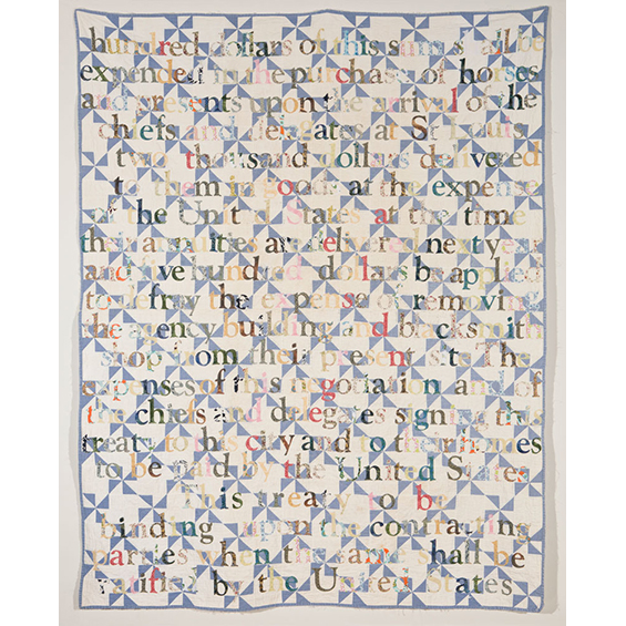 An image of a print with many nonsensical letters matched together and triangular traditional quilt patterns behind in blue on a white gorund.