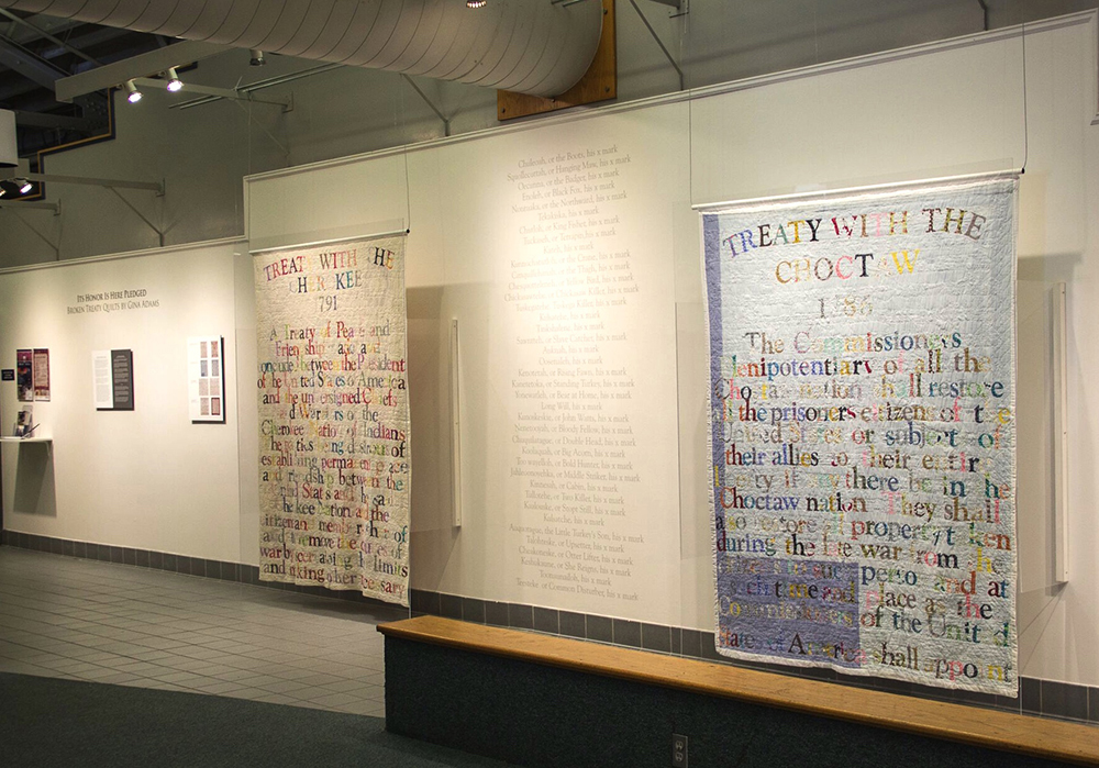 Installation view, Gina Adams: Its Honor is Here Pledged: Broken Treaty Quilts. USM Area Gallery, 2016. 
