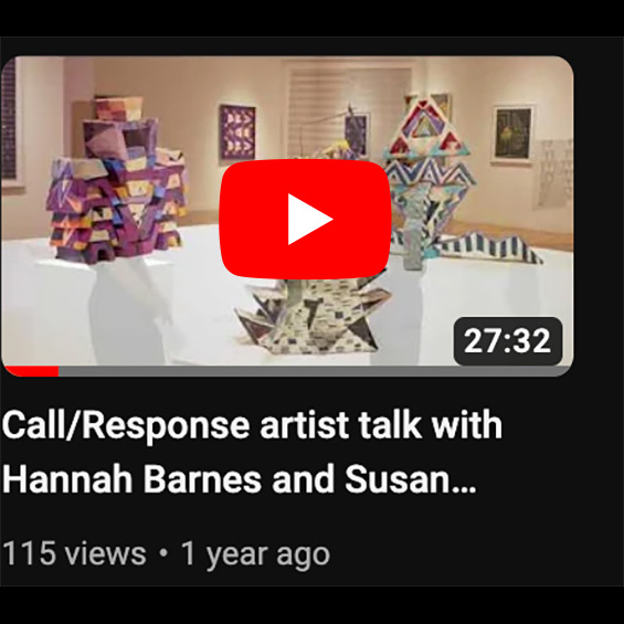An image of a youtube video featuring abstract geometric sculptures on a table