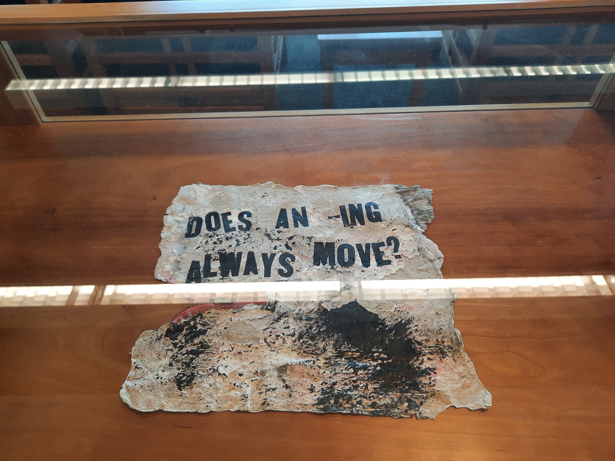 Jillian Bruschera, "Does an -ING always move?" 2015. Letterpress on handmade paper with zipper, 19 ½ x 12 in. (unframed). Part of "Pulped Under Pressure," 2022. Glickman Family Library.