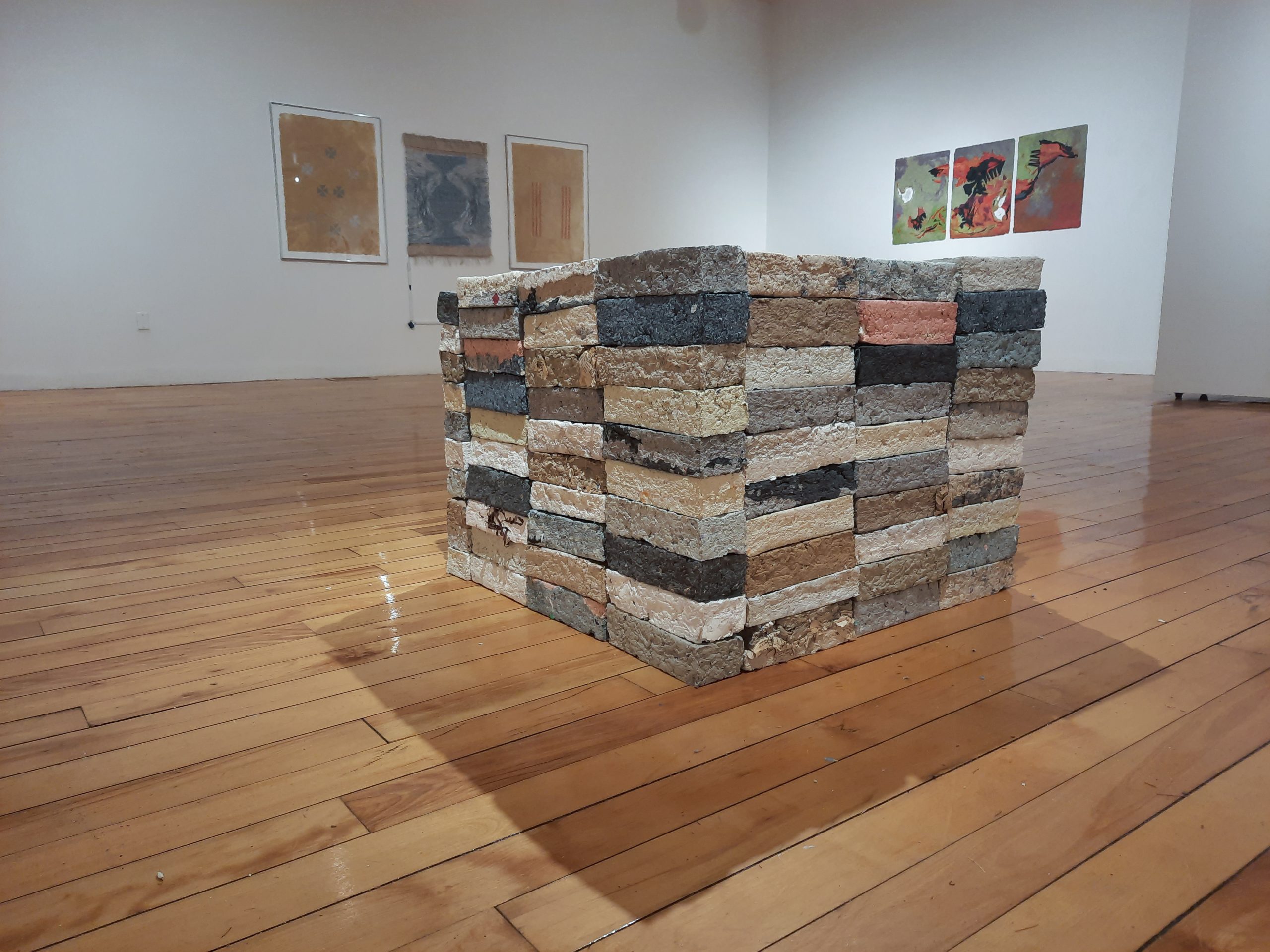 Jillian Bruschera, "Wastemade," 2014. Handmade paper bricks of waste collected by artist, dimensions variable. Part of "Pulped Under Pressure," University of Southern Maine Art Gallery, 2022.