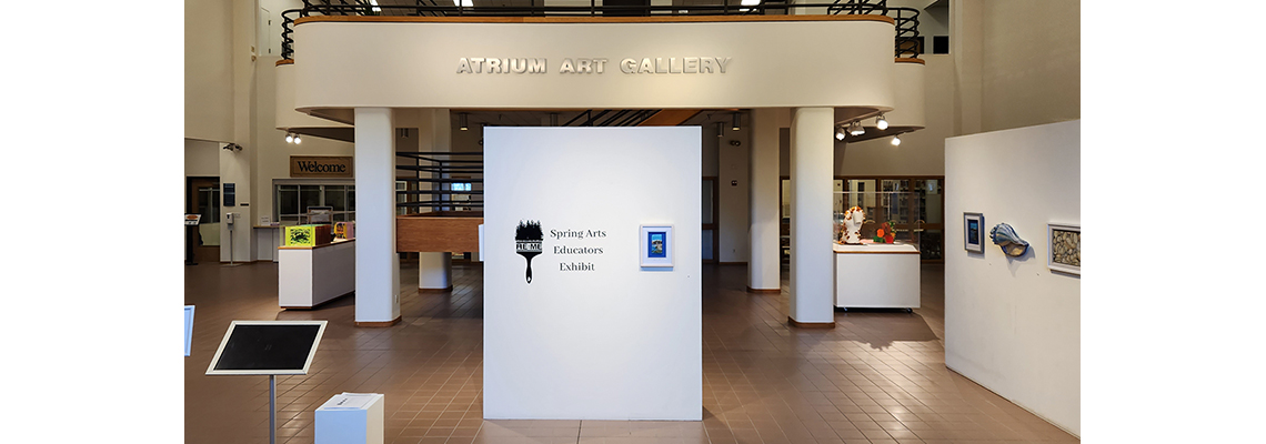 An image of an atrium with artwork on moveable walls.