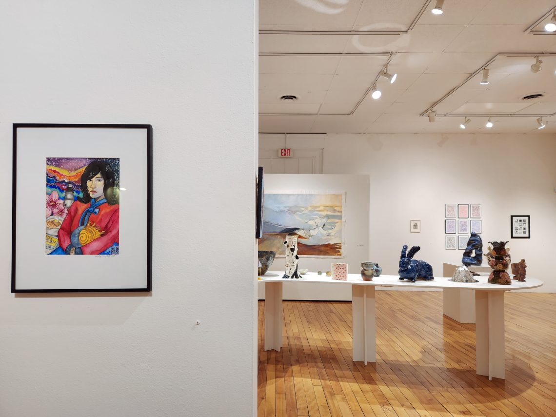 Installation view, "Parallel Convergence: The 2023 University of Southern Maine Juried Student Exhibition," University of Southern Maine Art Gallery. At left: Harley Harley Nimblett, "grandmother," 2022. Watercolor and micron pen, 9 x 12 in.