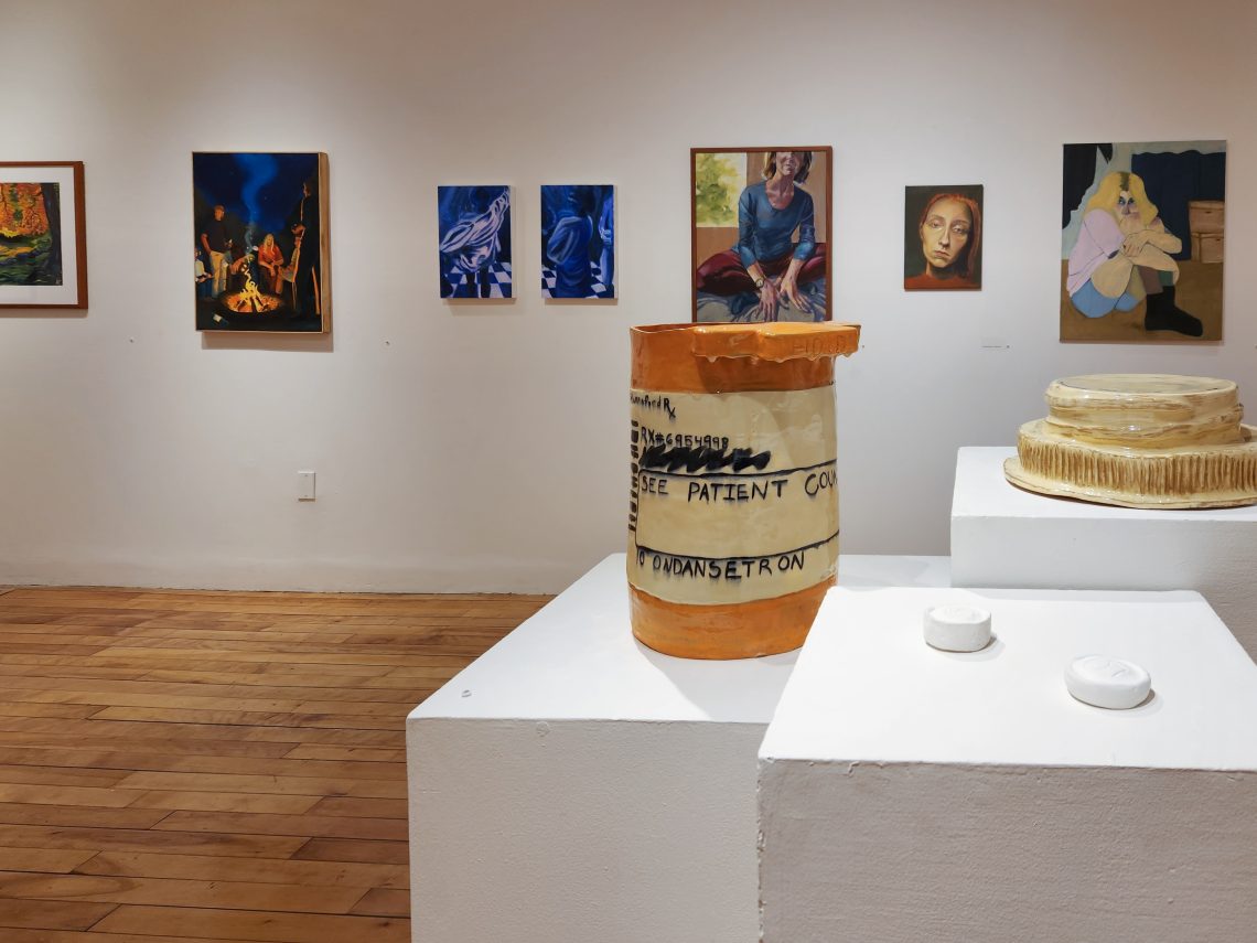 Installation view, "Parallel Convergence: The 2023 University of Southern Maine Juried Student Exhibition," University of Southern Maine Art Gallery. Foreground: Arun, "Don't Forget," 2022. Glazed ceramic. 14 in. wide x 13 in. long x 22 in. high.