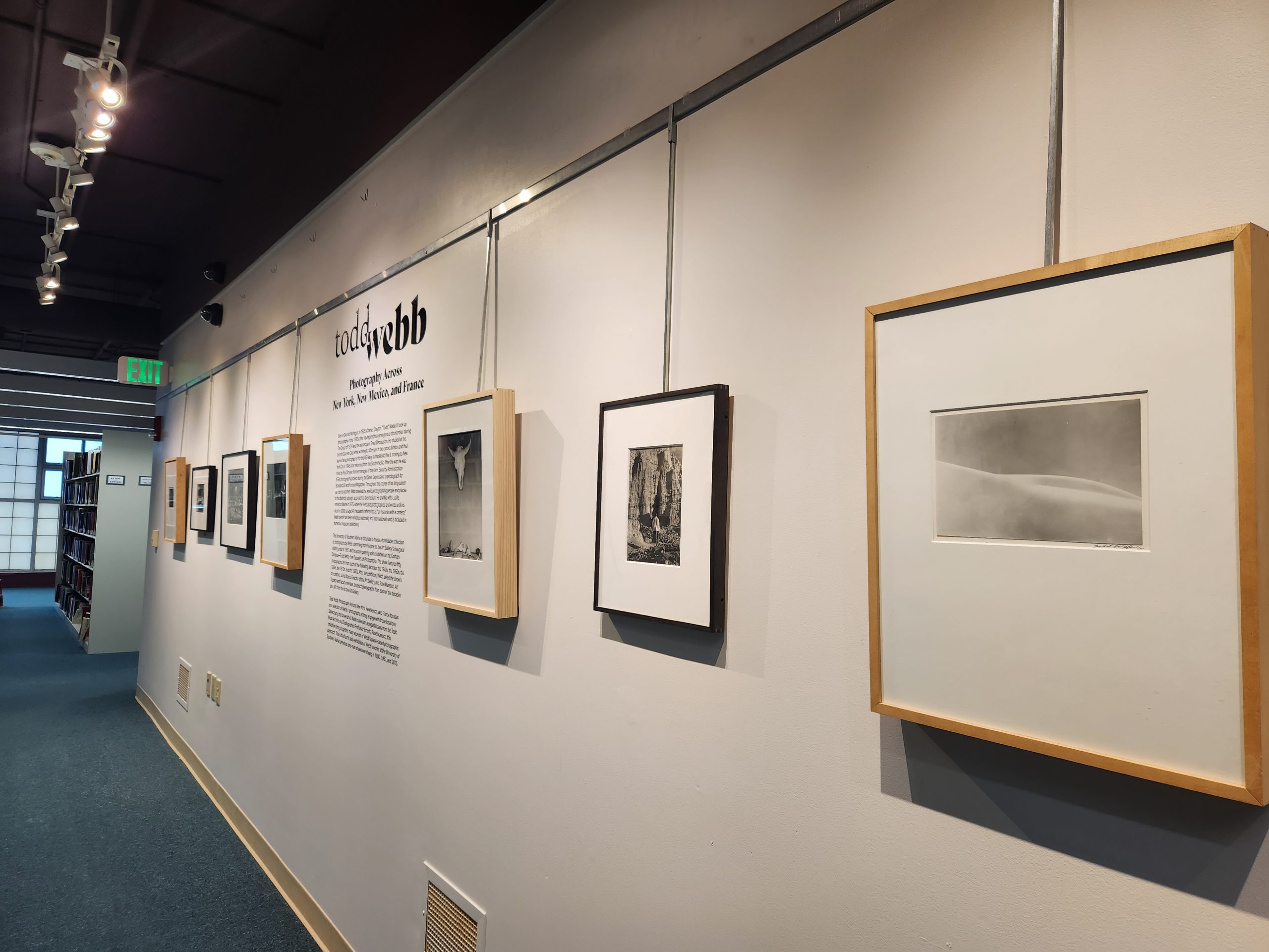 Foreground Right: "White Sands, NM," 1961. Silver Gelatin Print, 16 ¾ x 20 ¾ in. University of Southern Maine Collection. Installation view, "Todd Webb: Photography Across New York, New Mexico, and France." University of Southern Maine Glickman Library, 2023.