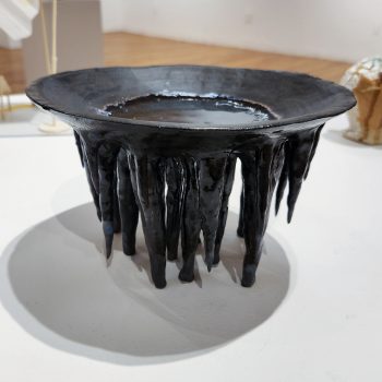Jeannie Doherty, "Stalactites," 2022. Clay, glaze, melted glass. 8 in. wide x 5 in. tall x 1 in. deep