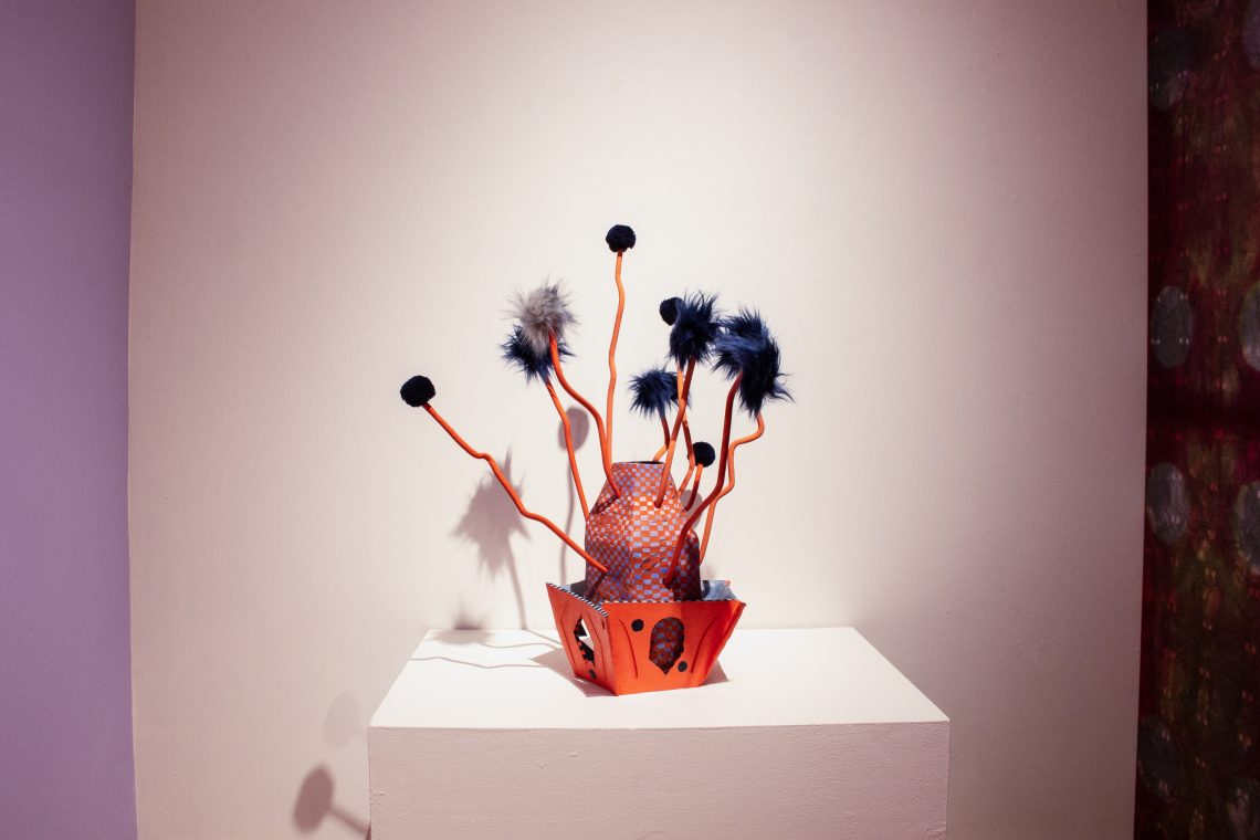 Susan Klein, Two Dots, 2021. Glazed and oil painted ceramic stoneware, pom poms, 30 x 25 x 22 in. Part of Call/Response: Hannah Barnes and Susan Klein. USM Art Gallery, 2021.