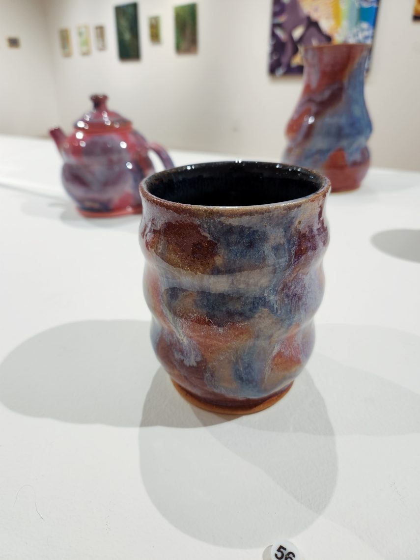 Annika Soderberg "Daydream Cup II" 2023. Stoneware, 3 1/2in. long x 3 1/2in. wide x 4in high. Part of the "2023 Bachelor of Fine Arts and Bachelor of Arts Exhibition," University of Southern Maine Art Gallery.