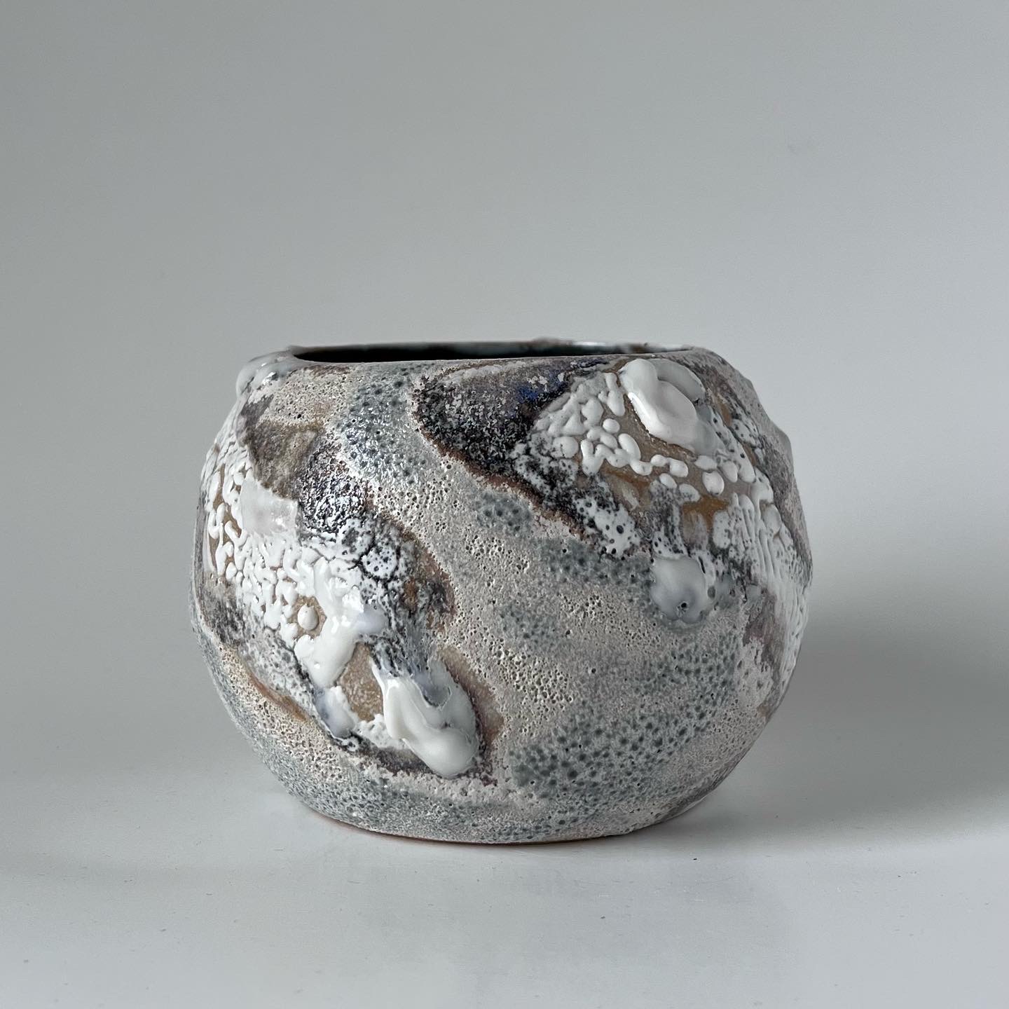 Krystal Yavicoli, "We Live on the Moon Now," 2023. Ceramic and glaze, 3 ½ x 4 ¼ x 4 ¼ in.