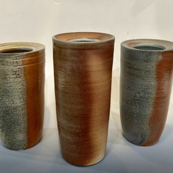 Christopher Cooper, "Nature vs. Nurture," 2023. Wood fired stoneware, left: 4 1/4 in. wide x 8 in. high x 4 1/4 in. deep; center: 4 1/4 in. wide x 9 in. high x 4 1/4 in. deep; right: 4 1/4 in. wide x 8 in. high x 4 1/4 in. deep. Part of "(t)here but not: The 2024 University of Southern Maine Art Department Exhibition," University of Southern Maine Art Gallery, 2024.