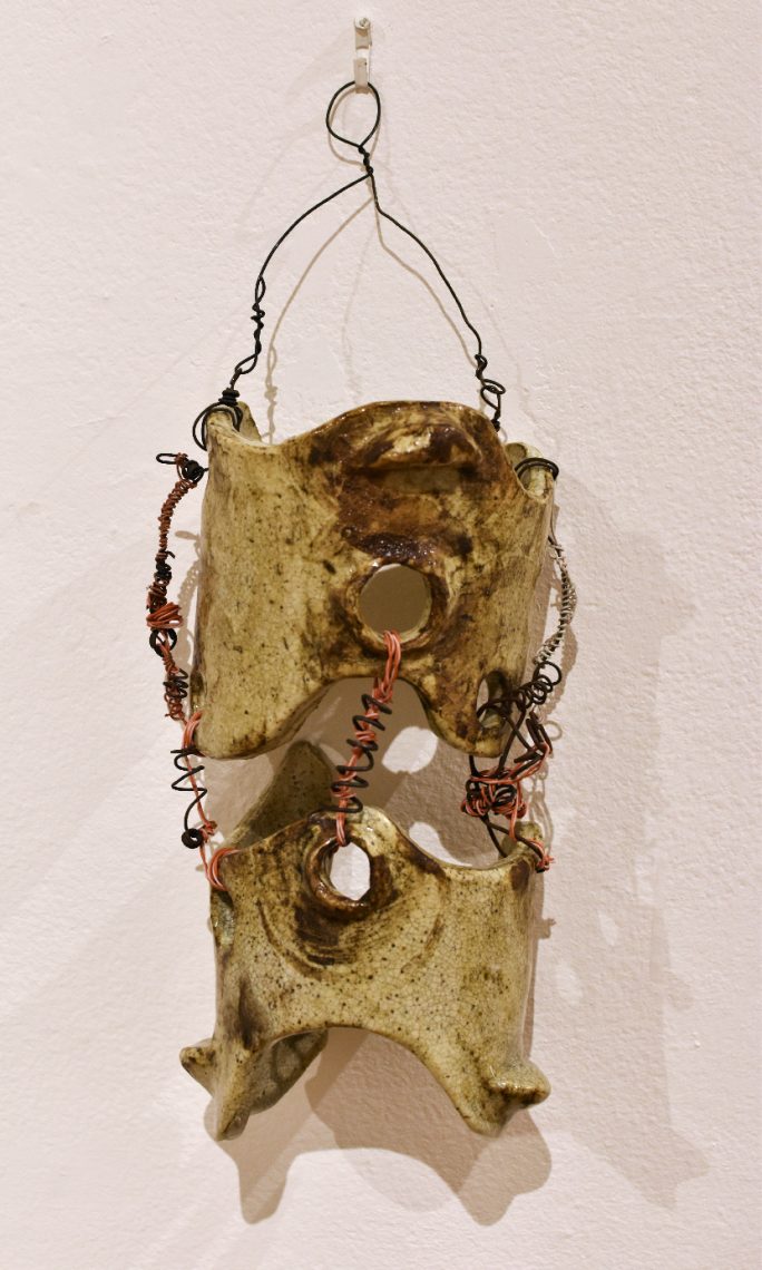 Clare Colburn, “Foundations”, 2023, Cone 6 stoneware, iron oxide wash, clear glaze, additive sculpture using recycled miscellaneous electrical wires, 5 in. wide x 12 in. high x 4 in. deep
