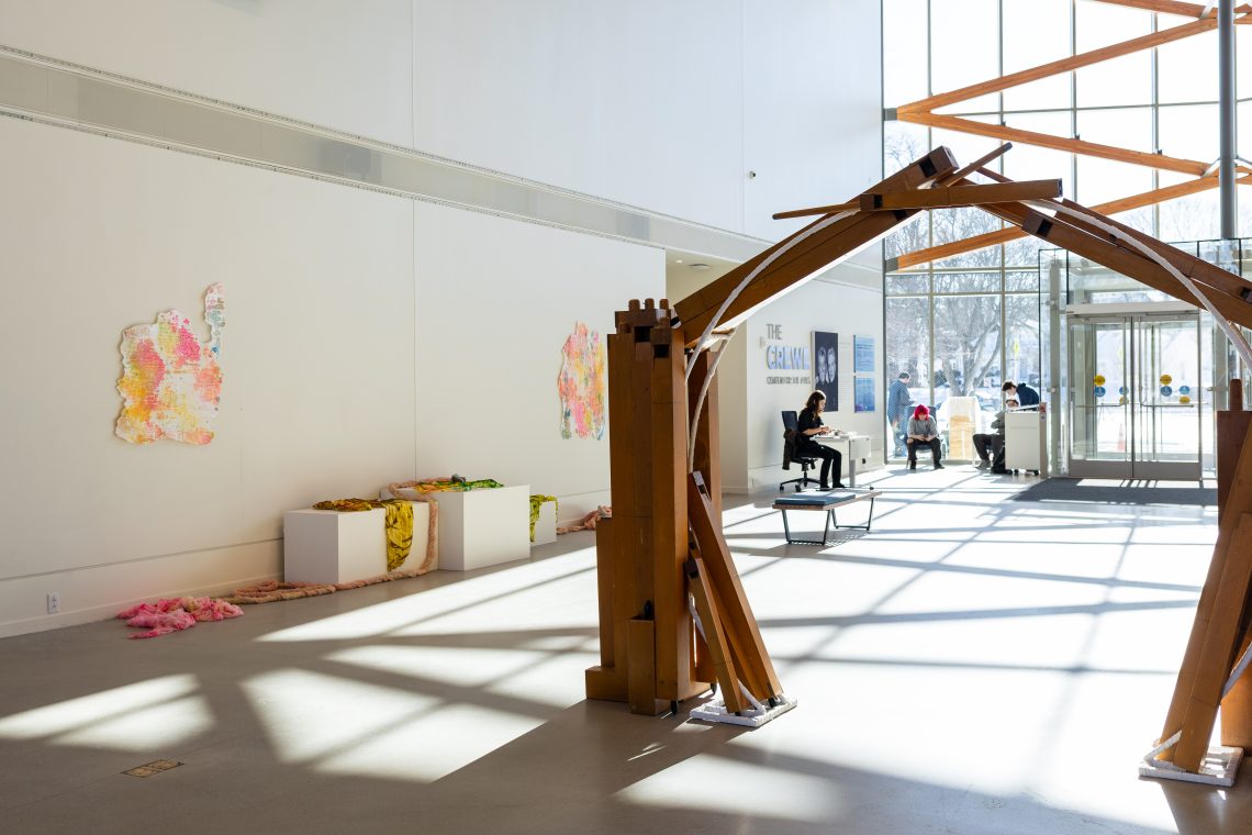 Foreground: work by Heather Lyon, "Portal (resonance)," 2026.
Pipeorgan, steel, and cotton. 64 in. high x 64 in. wide x 36 in. deep. Part of "Of Sibyls and Source: Ranges and Ruptures," 2026. Crewe Center for the Arts at the University of Southern Maine. Photo: Marion Earley.