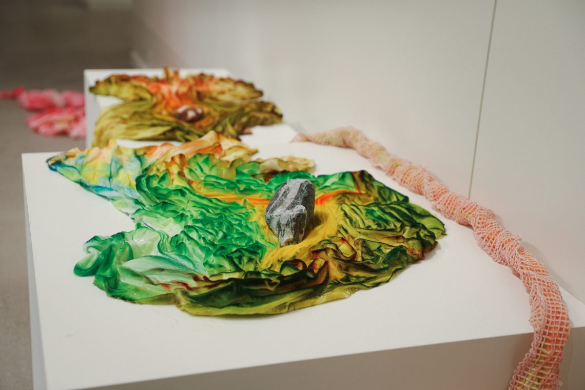 Samantha Jones, "Desideration of Stones," 2026. Stone, hand painted silk velvet; dimensions variable. Part of "Of Sibyls and Source: Ranges and Ruptures," 2026. Crewe Center for the Arts at the University of Southern Maine. Photo: Vivienne Predock.