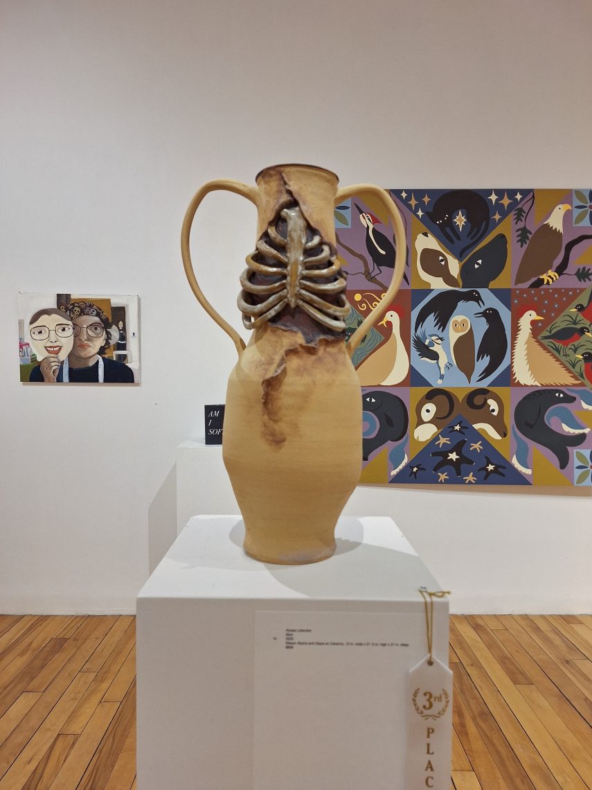 A vase whose neck is shaped like a rib cage.