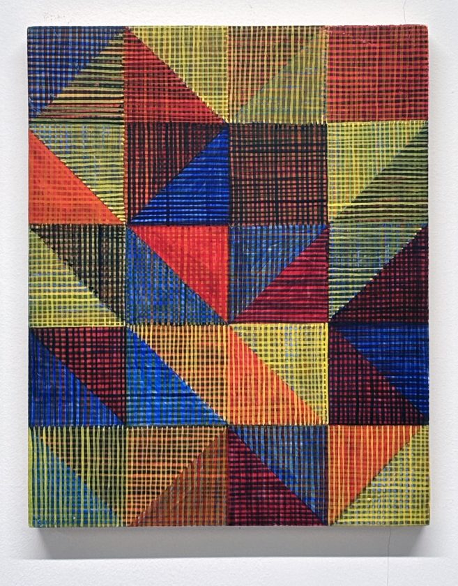 A grid painting showing triangles abutting one another with a cross hatch painted by hand over them.