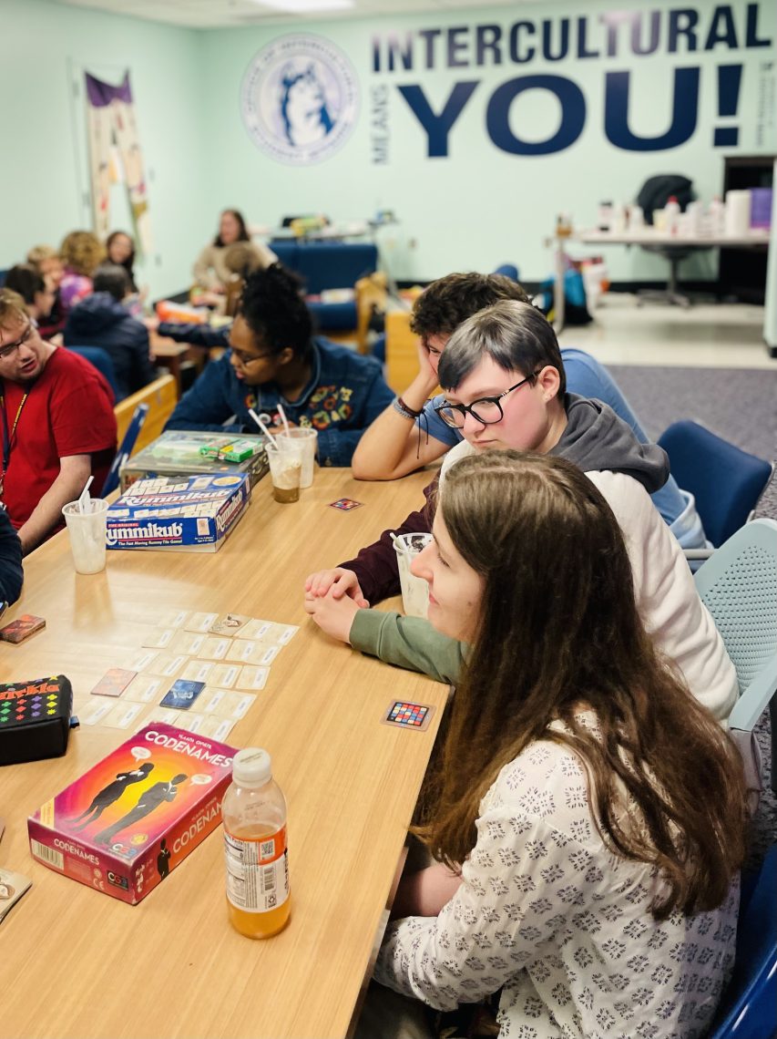 Image of the Gorham Diversity center with students playing board games. 