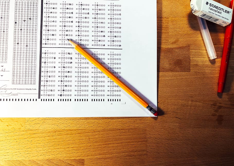 Pencil sitting on top of a scantron page