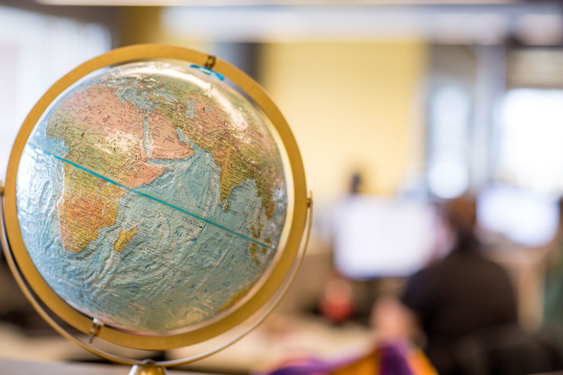 A photo of a globe in a classroom.