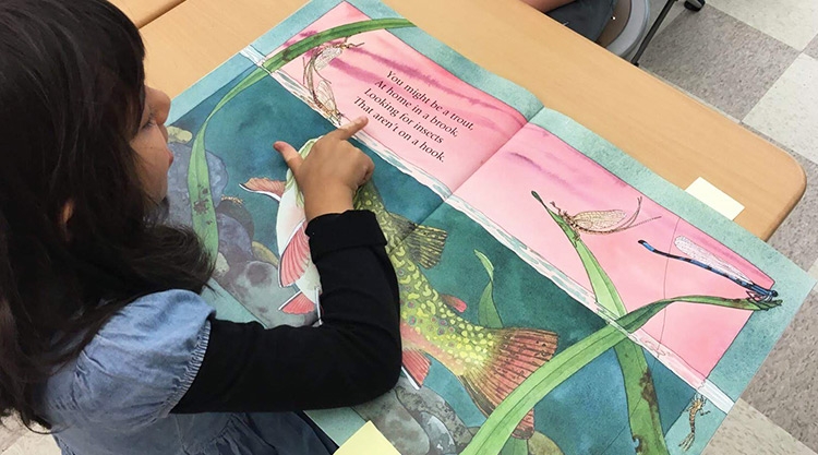 Student reading a book