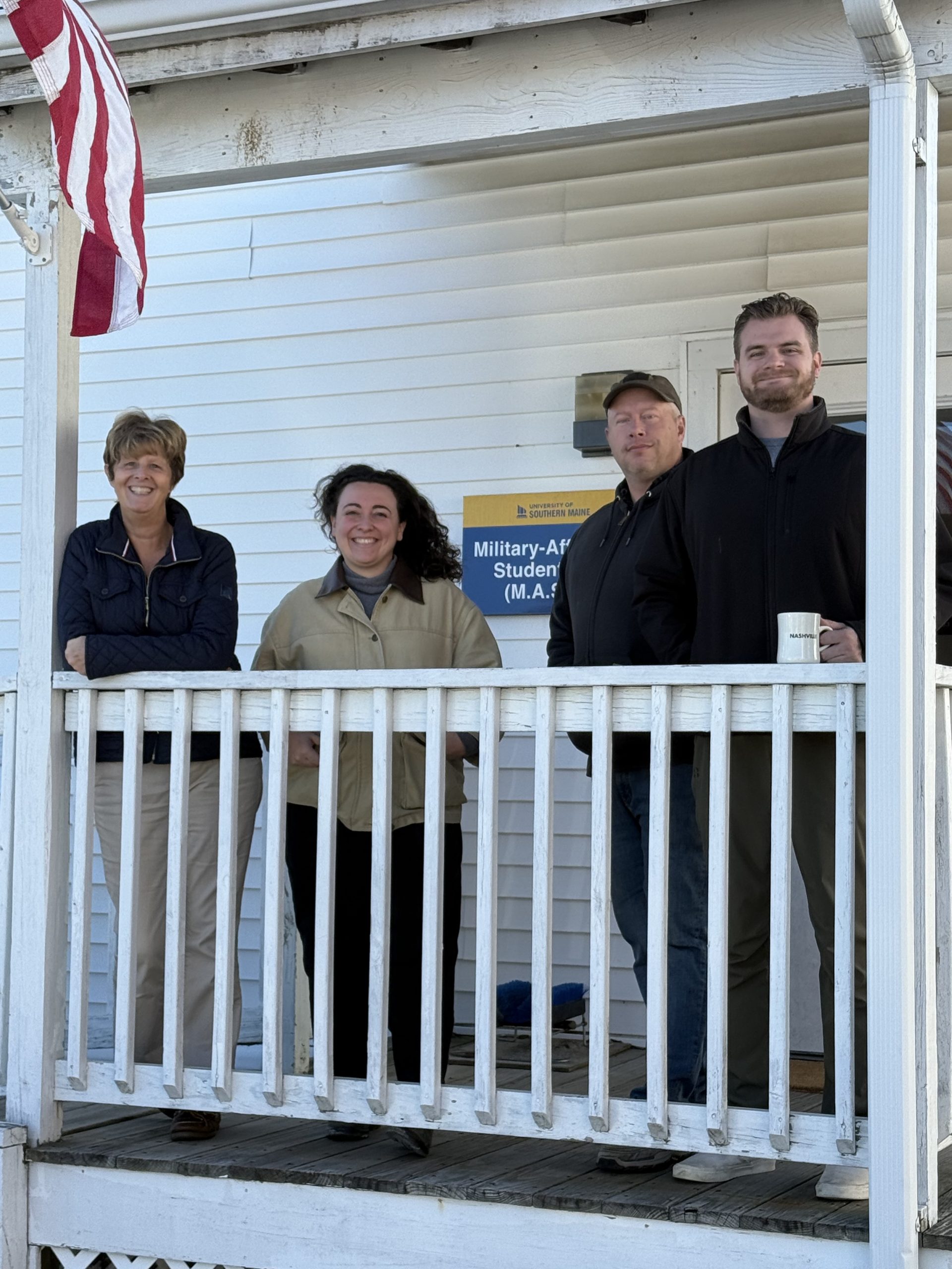 Staff at USM pose at new building