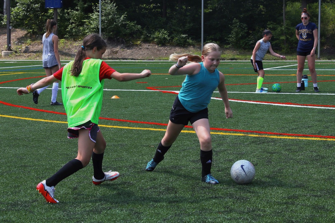 New Hannaford Field turf plays host to girls soccer camp.