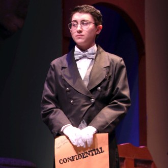 Wadsworth (Atticus Watson) holds his secrets close to the vest in Clue: On Stage