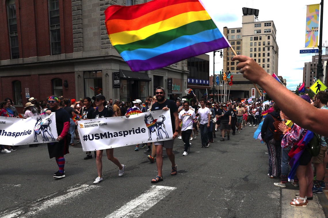 USM delegation to 2022 Pride Portland! parade marches down Congress Street.