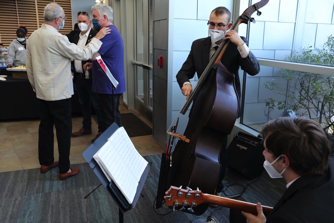 A string duo provided music while guests mingled at the 50th anniversary celebration of the School of Social Work.