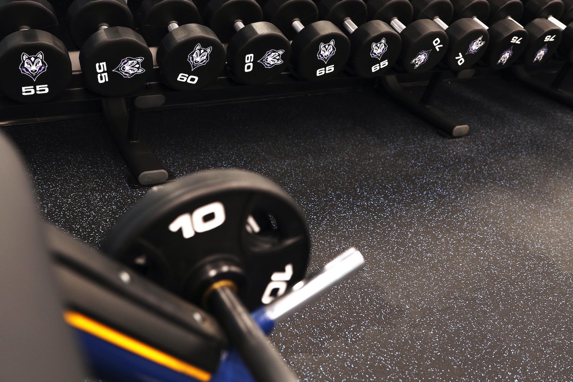 New free weights at Sullivan Gym are all customized with USM's Husky logo.