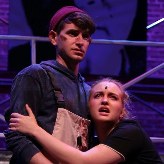 Love struggles to survive in the dystopian future of Urinetown.