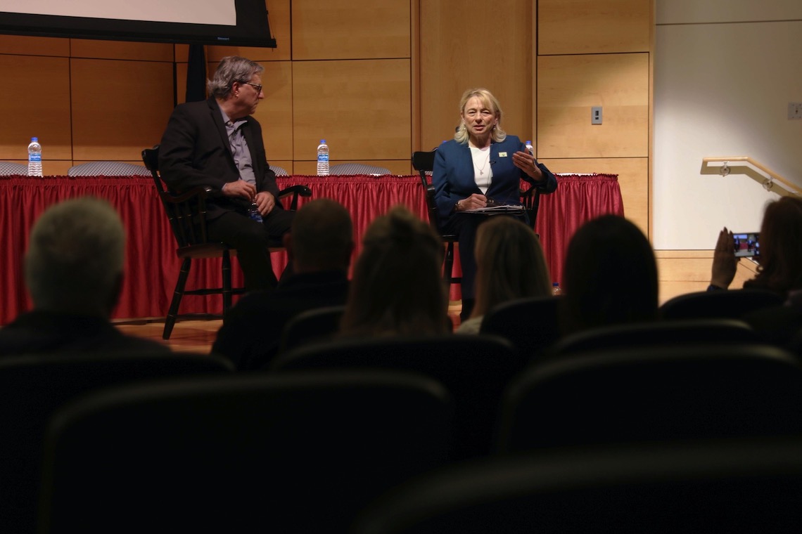 Gov. Janet Mills and reporter Sam Quinones take questions from the audience at a forum on opioid abuse.