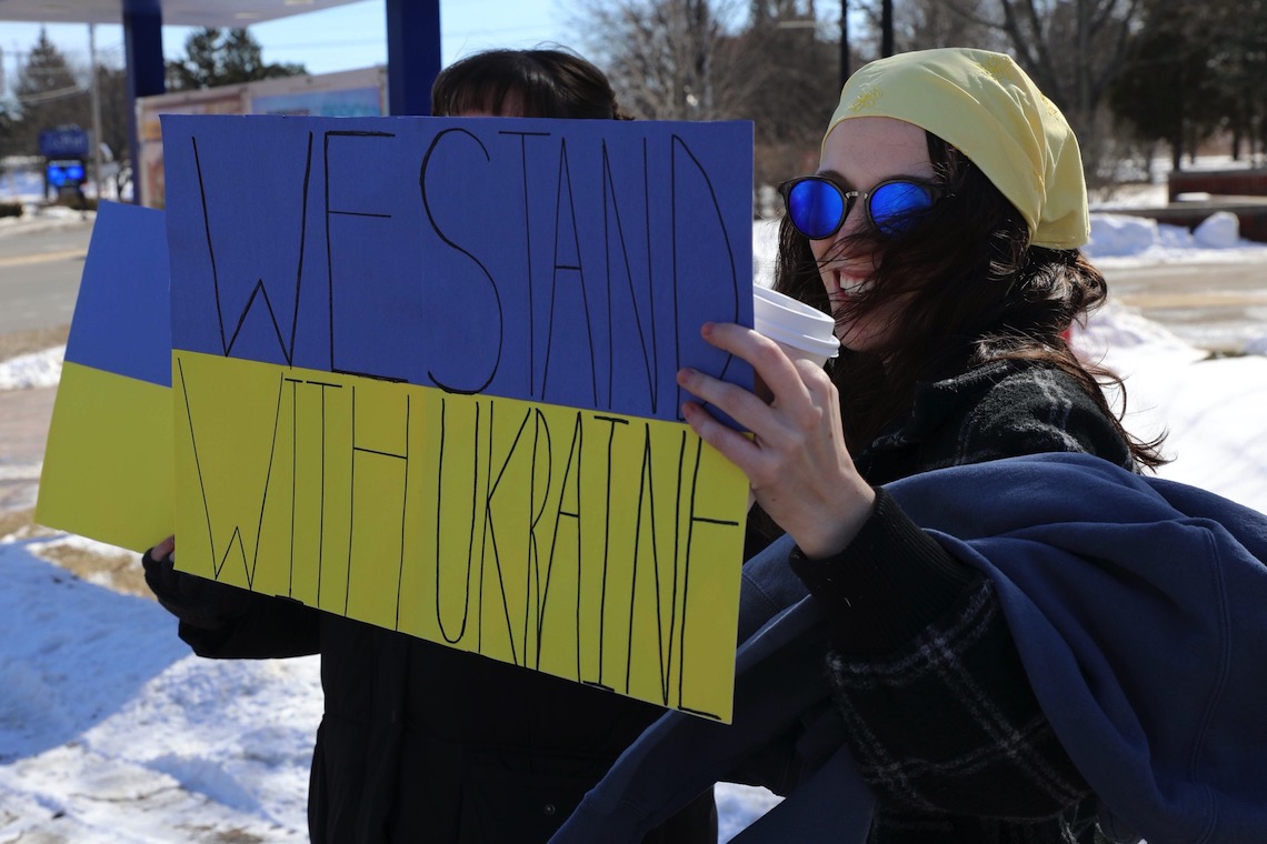 Demonstrators decorated their signs in blue and gold to match the Ukrainian flag.
