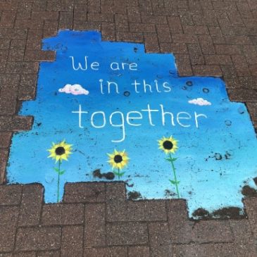"We are in this together" sidewalk mural