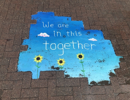"We are in this together" sidewalk mural