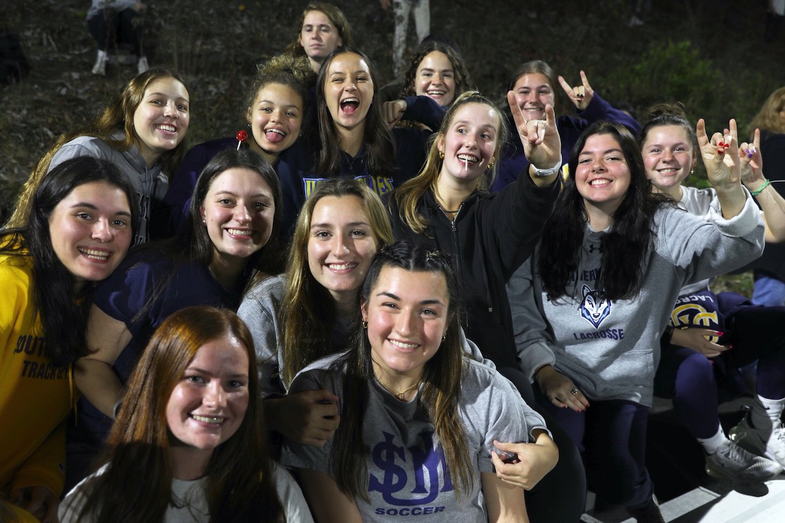 Fellow athletes filled the stands to support the women's soccer and field hockey teams as they competed for their respective conference championships.