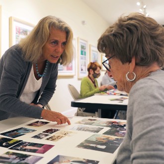 Paula Gerstenblatt offers tips at a collage workshop at the Maine Jewish Museum.
