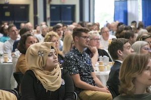 Students and staff seated at tables during the 2019 Opening Breakfast in the Costello Sports Complex.