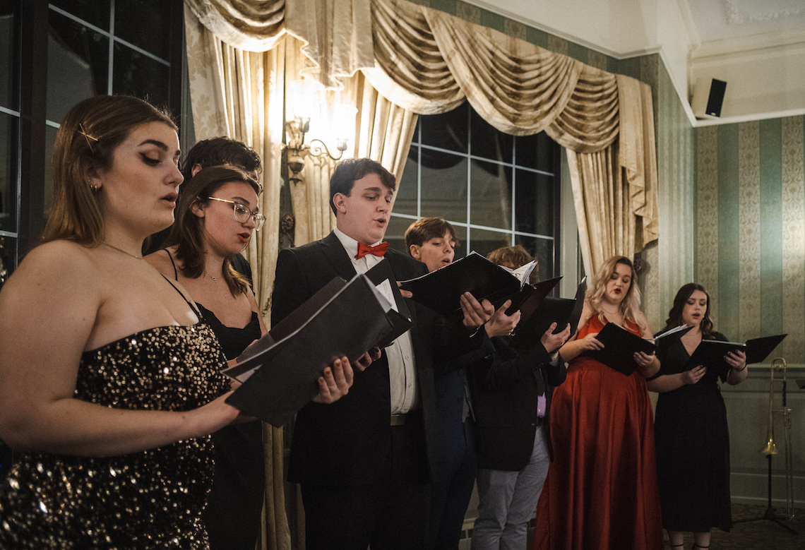 The Osher Chamber Singers set the holiday mood with Christmas carols at the 2022 Osher School of Music annual scholarship gala.