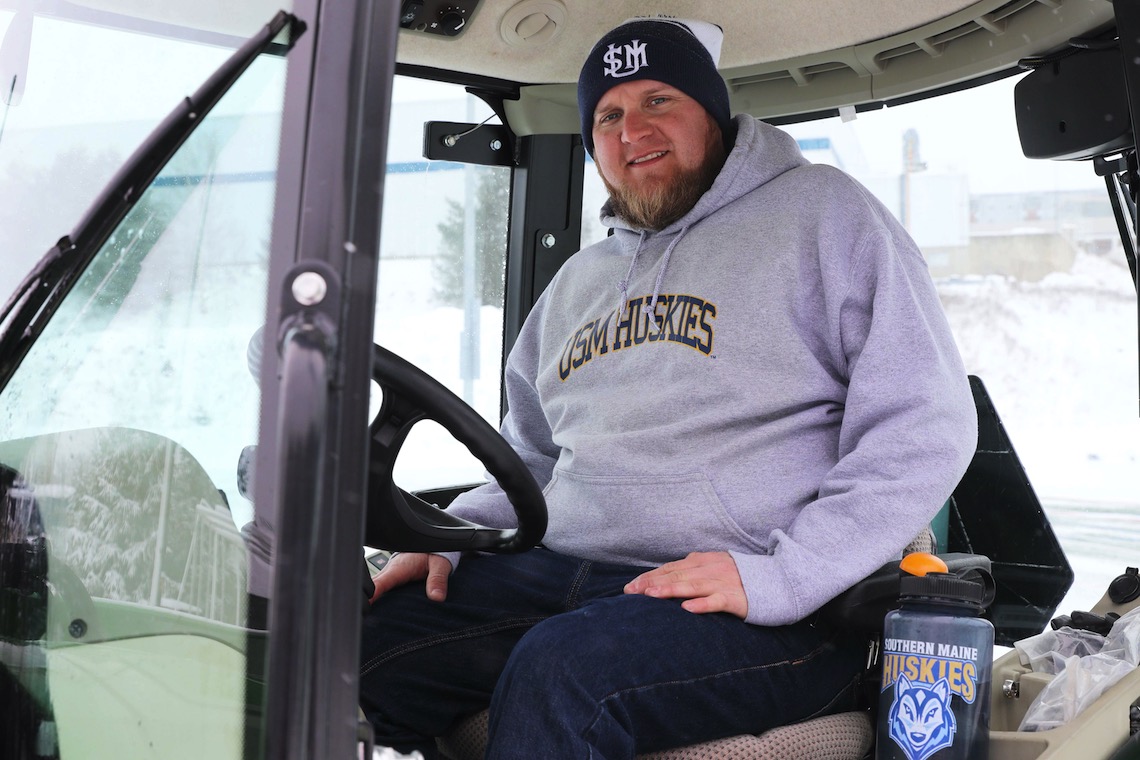 Matt Hirsch drives the plow vehicle that clears the snow off of Hannaford Field.