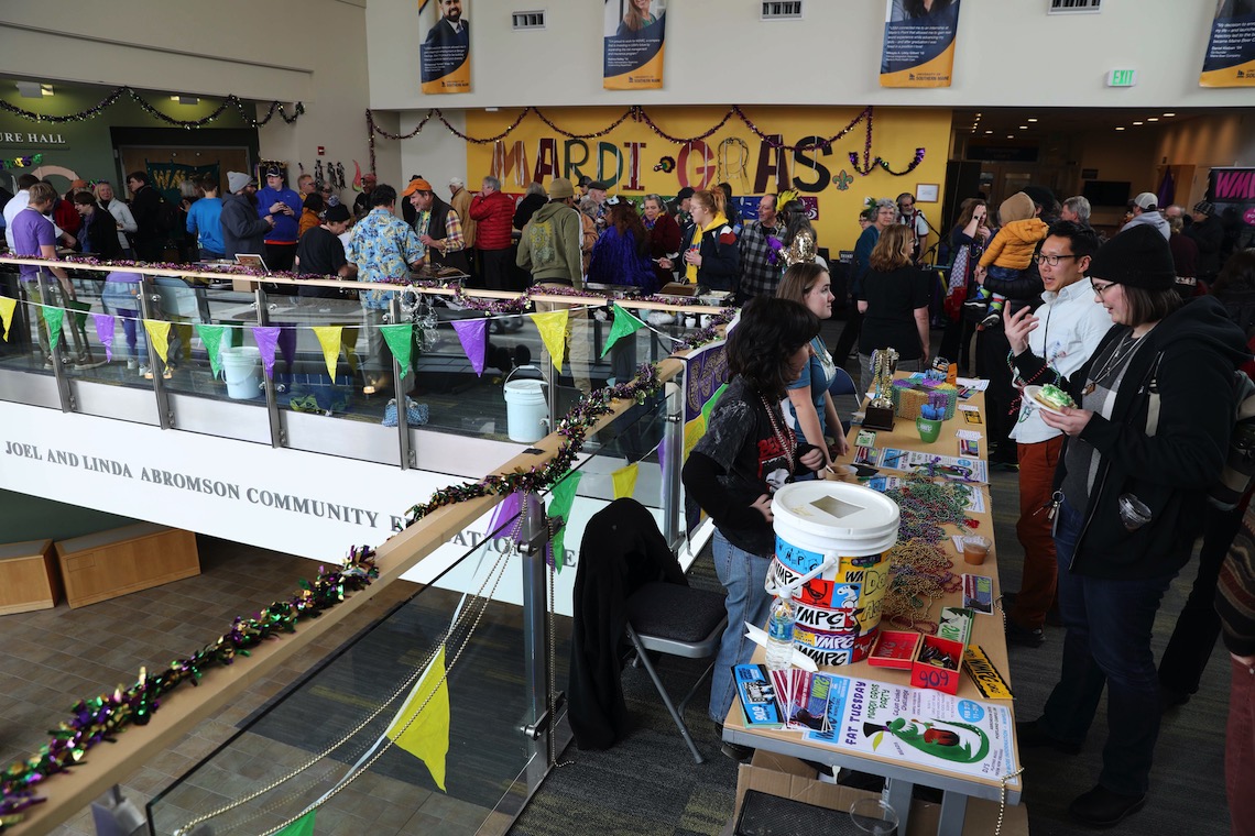 The second floor of the Abromson Center was packed with visitors to WMPG's Mardi Gras party.