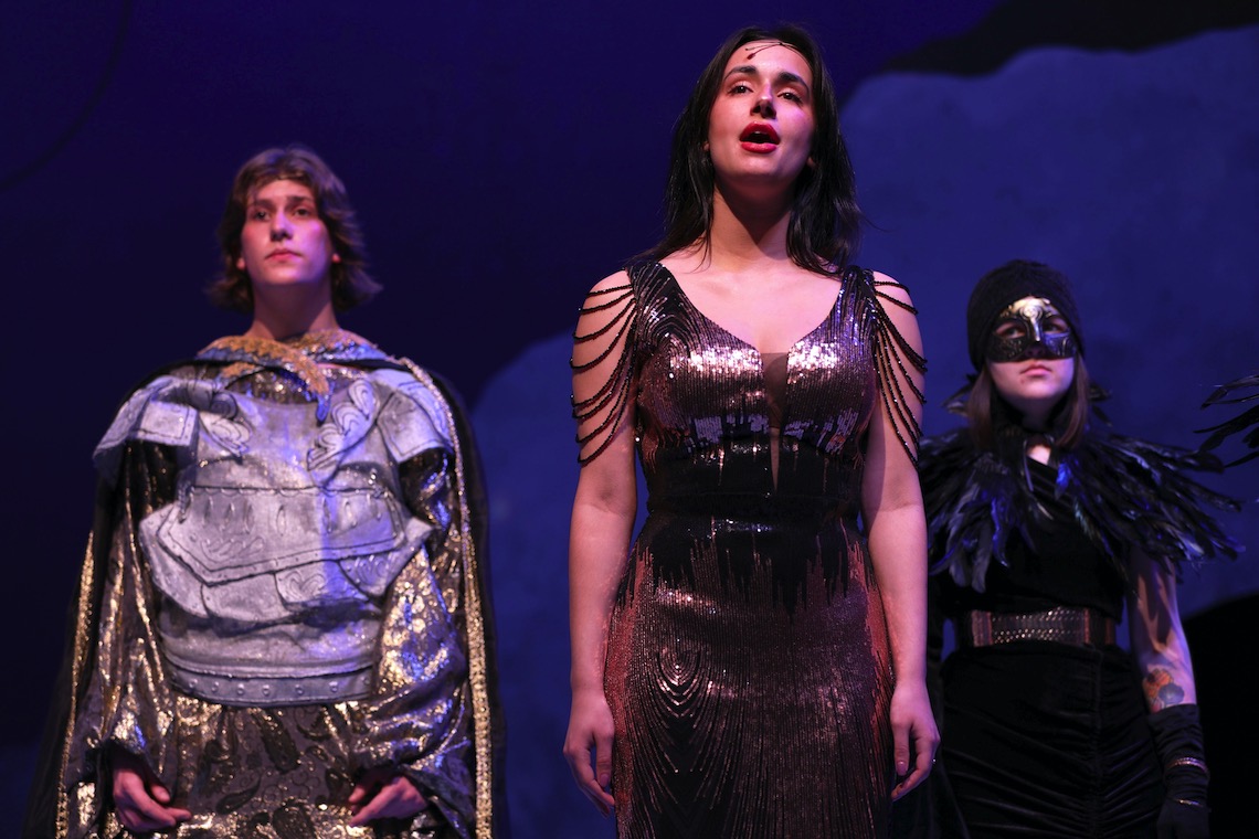Persephone (Caroline Woods) sings as Hades (Jack Dodd) and a Fury (Mikayla Freeman) look on in a scene from "Eurydice Rising."