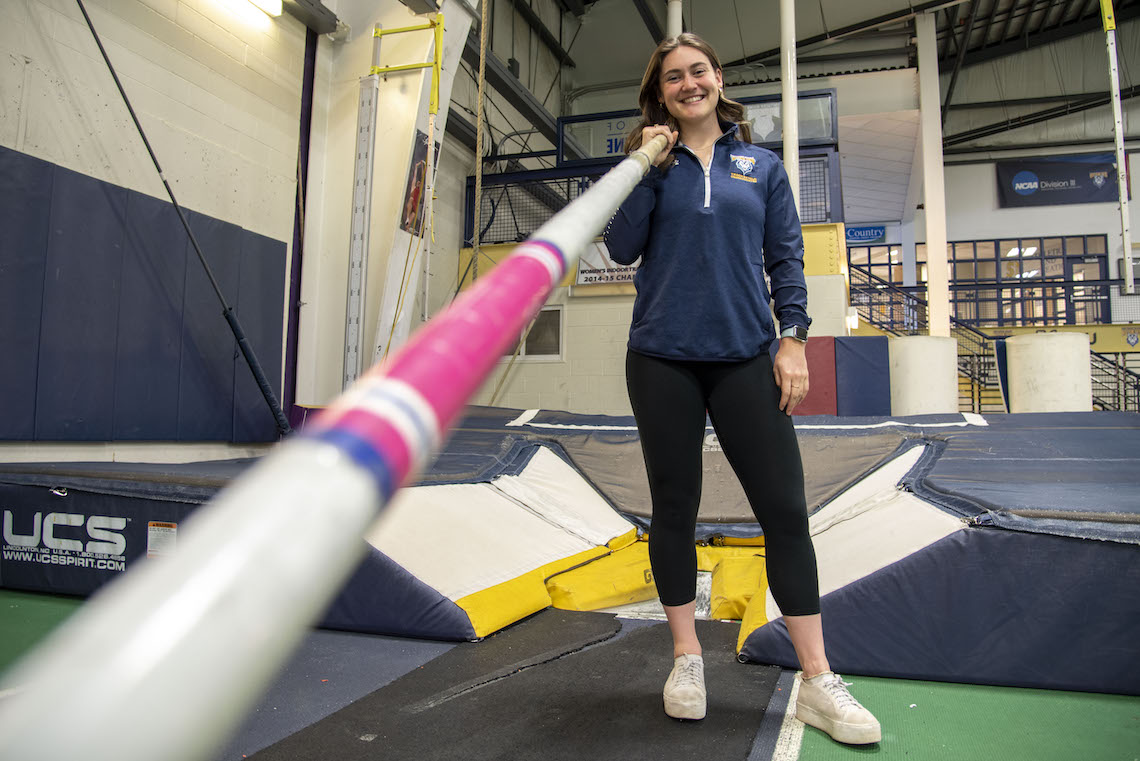 Sophia Slovenski stakes her territory at the pole vault pit in the Costello Sports Complex.