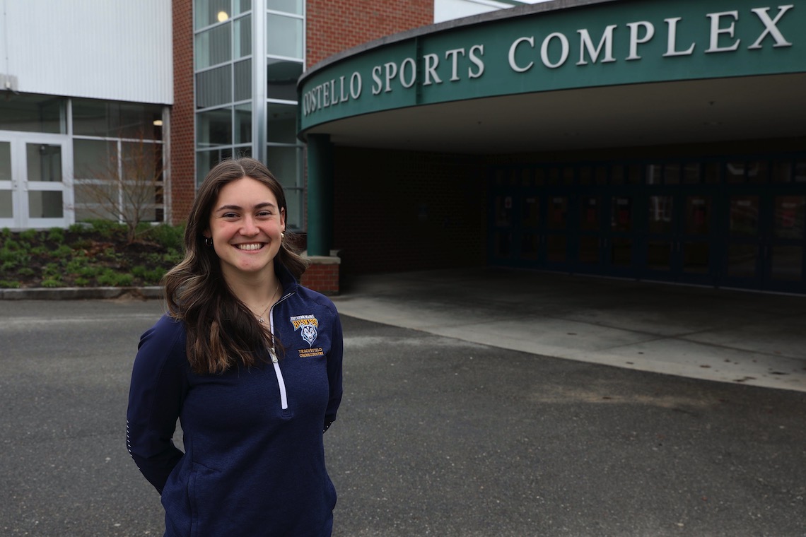 Sophia Slovenski stands at the main entrance to Costello Sports Complex.