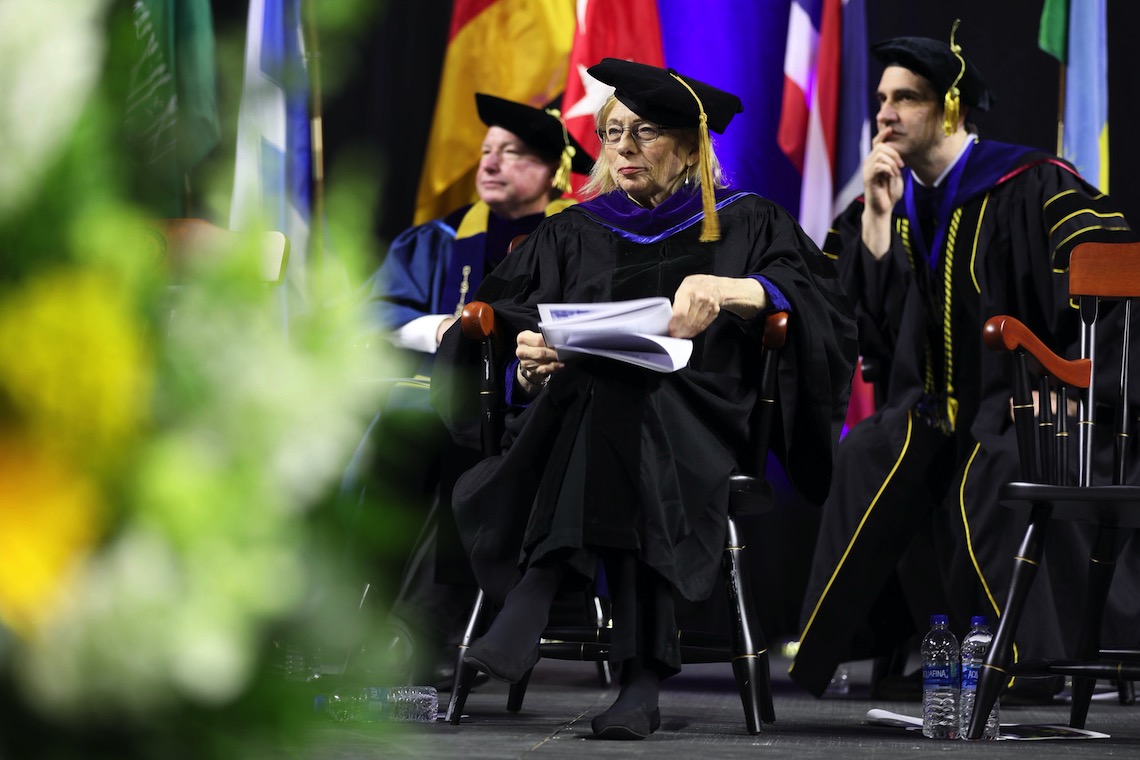 Gov. Janet Mills waits to congratulate her grandson who is among the graduates at the 2023 Commencement.