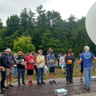 Students prepare to launch their cubesats on a balloon
