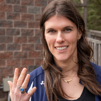 Husky lacrosse great Jessica Knight Tremblay flashes her newly acquired LEC Hall of Fame ring.